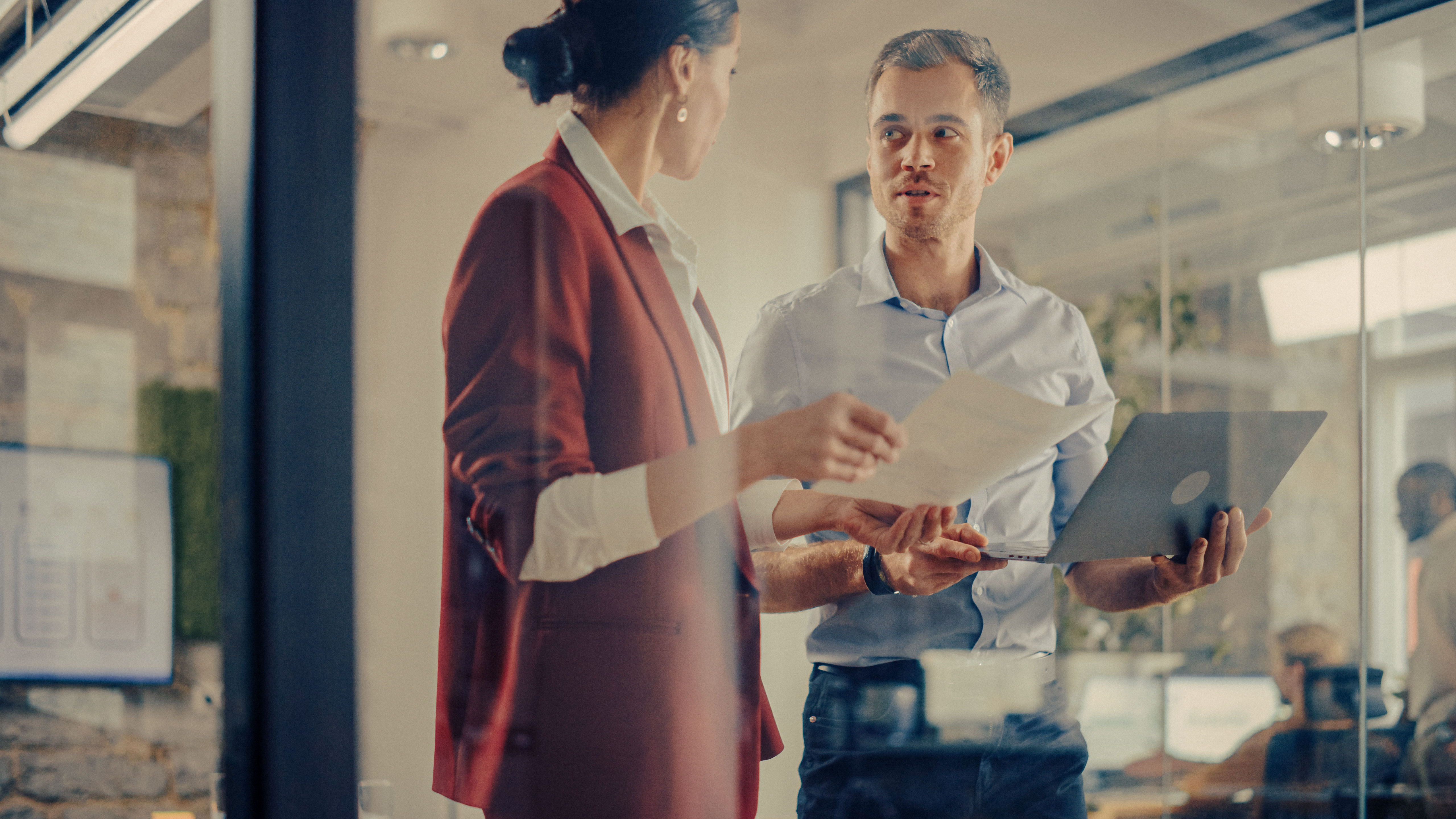 CEO and Chief Executive Talking About Company Business Growth, Consult Data Analysis and Use Laptop Computer. Two Professionals Discussing Revenue Increase, Market Disruption, Planning Strategy